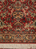 Tempting terracotta ground Kashmir Silk rug.