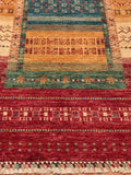This Afghan Loribaft runner features a frame design not dissimilar to Gabbeh designs