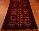 deep red cream and brown colourings have been used in th Afghan Belouch tribal rug