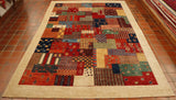 Blocks of colour next to each other in a patchwork effect.  Some of the blocks have decoration upon them, others are plain.  There are a few depictions of animals and plants too.  The blocks of colour are a mix of orange, red, dark blue, green, yellow, blue, cream, burgundy and bright red.  There is a wide cream/oatmeal border. 