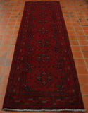Dark Raspberry red ground with deep blue used for the decorative work.  There are 7 medallions going through the length all decorated identically.  And there are decorated borders of varying width and design. 
