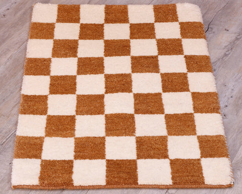 This small mat has a chequerboard design across it using cream and tan. 