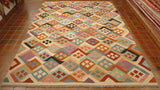 Different design and colouring used in this Afghan kilim and the fact that it has no borders makes it more unusual. The colour combination works really well using soft pink, gunmetal grey and pale blue. Other colours used are brick red, tan, cream and touches of black here and there.