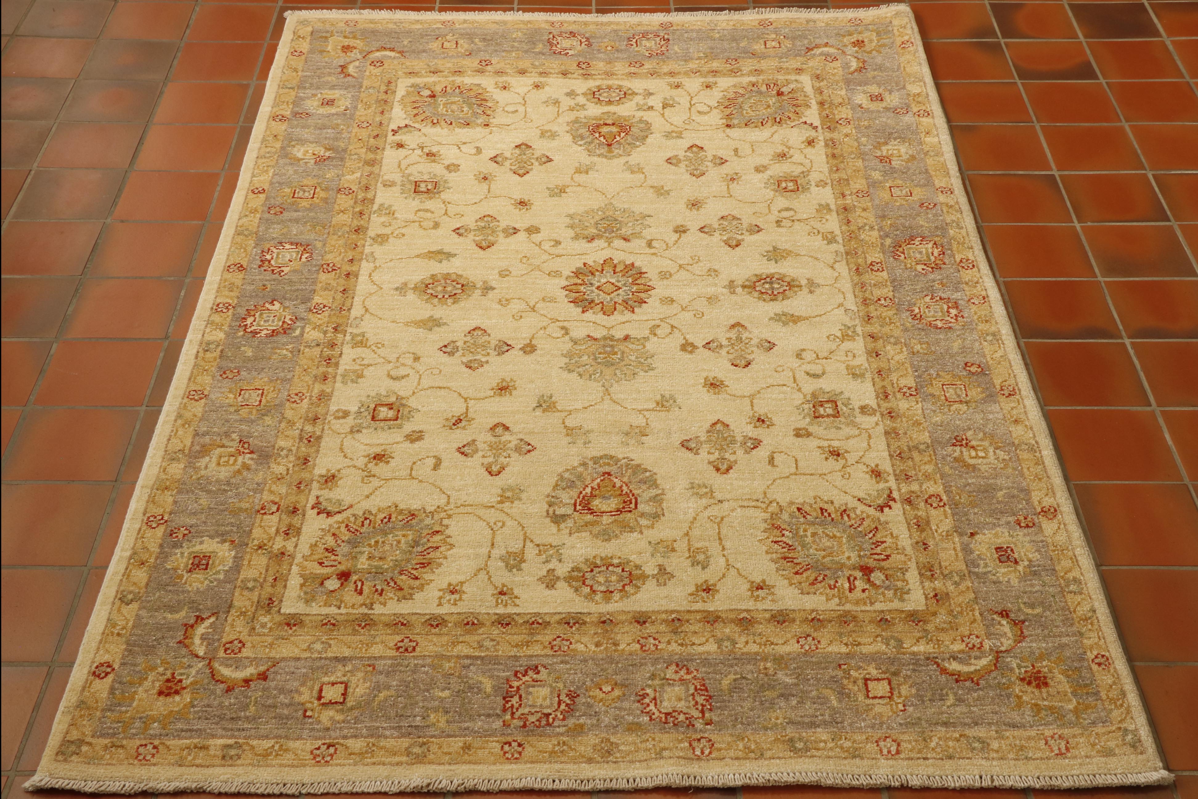  Cream ground fine Afghan Ziegler rug has a nod to the more up to date colour schemes as the outer border is a lovely gentle grey. Addition of warm buttermilk. Decoration connecting floral motifs. 